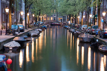Amsterdam, Netherlands - April 21, 2017: One of the channels in Amsterdam with many boats.のeditorial素材