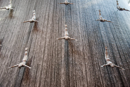 Waterfall flying men in Dubai Mall - worlds largest shopping mall, Dubai, UAE
