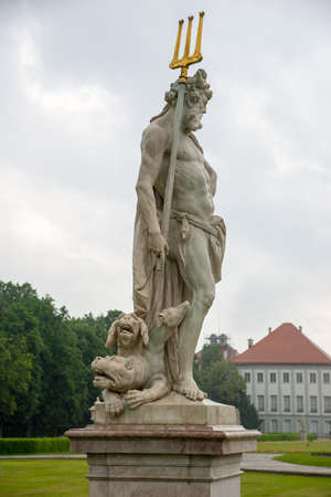Munich, Germany - June 8. 2016: Statue Pluto by Dominik Auliczek in the Baroque garden of the Nymphenburg Palace.のeditorial素材