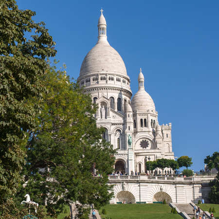 PARIS - SEPT 18, 2014: Tourists near the Basilica of the Sacred Heart of Paris or Sacre-Coeur is a Roman Catholic church. Located at the summit of the butte Montmartre. Paris, France.のeditorial素材