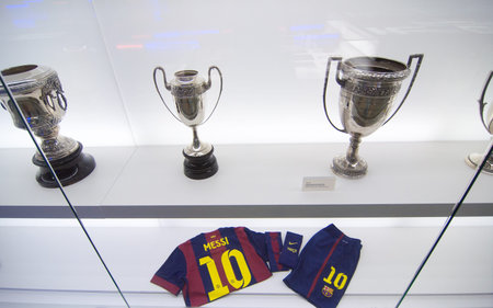 Barcelona, Spain - September 22, 2014: Football shirt and shorts of Lionel Messi. One of the trophy...