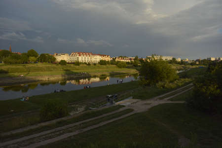 Dark clouds over Warta riverの写真素材