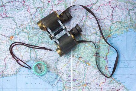 Binocular and compass on a mapの写真素材