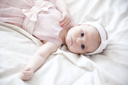 beautiful newborn girl in beautiful pink dressの写真素材