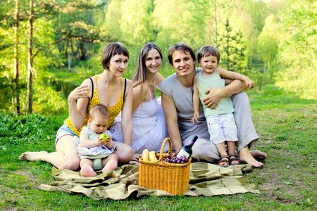 happy family having picnic in the natureの写真素材