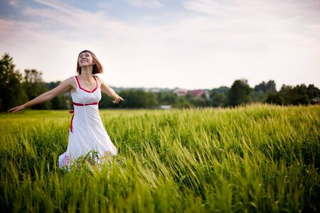 happy young woman enjoying natureの写真素材