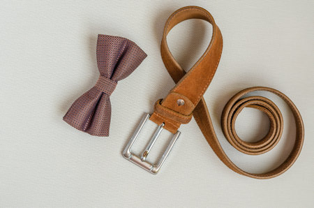 Brown set of clothing accessories for sophisticated men. View from above. Selective focus. Landscape...