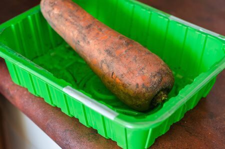 Unpeeled vegetable on the kitchen table. The process of preparing homemade food for the family. Close-up. Selective focus.の写真素材