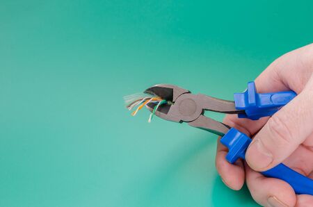 Network technology specialist makes repairs. Close-up. Selective focus. View from above.の写真素材