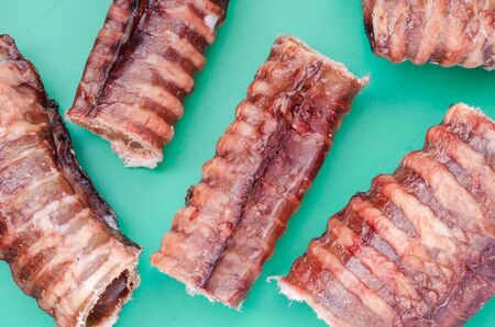 Natural chewing treats for dogs. Love for domestic animals. Pet supplies. Side view. Selective focus. Close-up.の写真素材