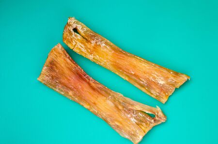 Demonstration of dried chewing treats for dogs. View from above. Close-up. Selective focus.の写真素材