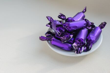 White porcelain saucer full of delicious sweets. Traditional sweets. Eye level shooting. Close-up. Selective focus.の写真素材