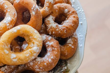 Top view on hot donuts with icing sugar. Real homemade food.の写真素材
