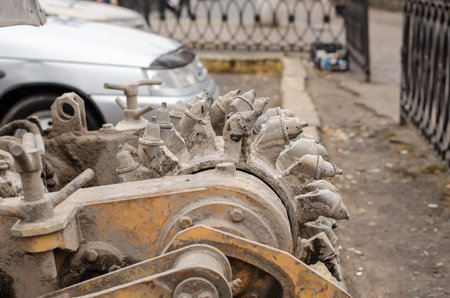 Road machinery with a dirty cutter in the parking lot. Side view. Selective focus. Shooting...