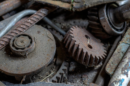 Rusty metal and gears. Old workbench covered with dust and cobwebs. Industrial background. Close-up....