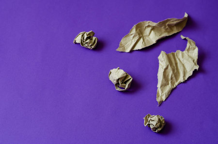 Crumpled and torn pieces of paper on a light blue background. Five different pieces of paper. The...