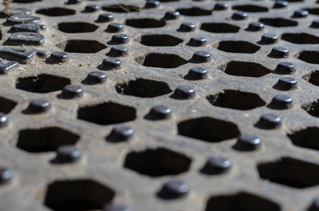 Geometric background of hexagons in a receding perspective. Repeated hexagonal holes and round...