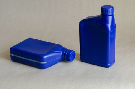 Two blue plastic canister for lubricants without label, container for chemicals.1 liter plastic containers. Close-up. Selective focus.の写真素材