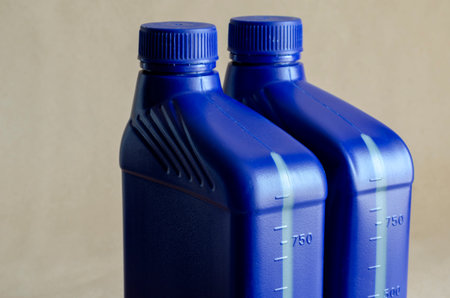 Two blue plastic canister for lubricants without label, container for chemicals.1 liter plastic...