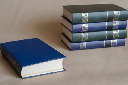 Hardcover book collection. Five books from one collector's edition on the table. Education, hobbies,...