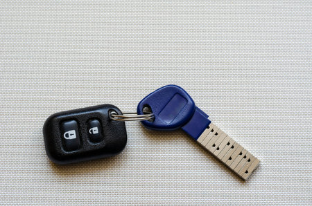 Chipped door key with remote control. An innovative key with a unique secret combination. Modern...
