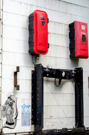 Nikolaev, Ukraine - May 31, 2020: Fragment of a truck trailer with boxes for fire extinguishers and electrical outlets. Commercial freight transport and logistics. Fire safetyのeditorial素材