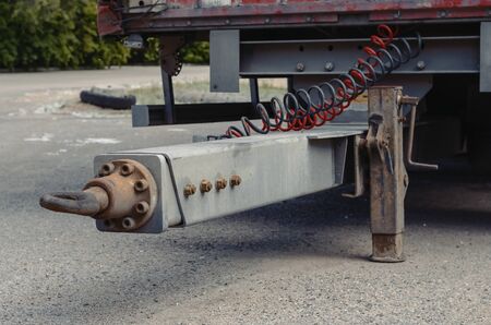 Traction - trailer coupling of a lorry trailer. The trailer stands on a support jack. Commercial freight transport and logistics.の写真素材