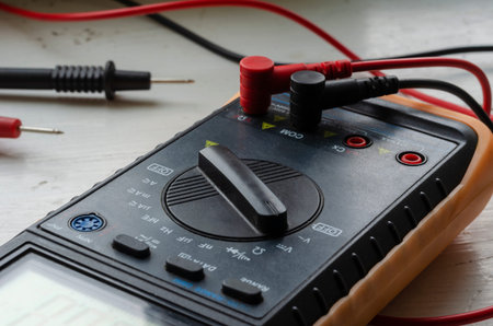 Close-up of a multimeter on a light background. Detailed shot of a measuring device. Qualified...