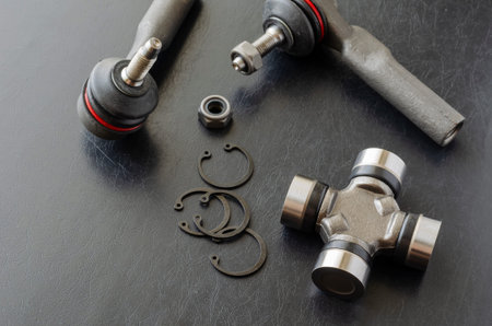 Cross joint of the propeller shaft and a set of tie rod ends. New auto parts for transmission. Trade...