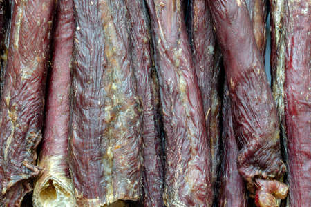 Dried beef esophagus. Natural treats for dogs background. Detailed shot. Pet products of premium quality. View from above.の写真素材