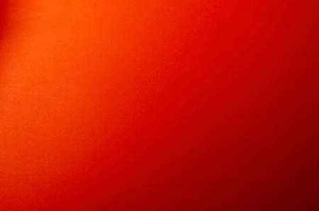 Abstract red background with gradient transitions and shadows. Multi-tasking background for variety of design tasks. Design, decoration, advertising.の写真素材