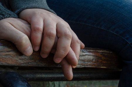 Concept of love, loyalty, caring, tenderness, protection. Touching the male and female hands....