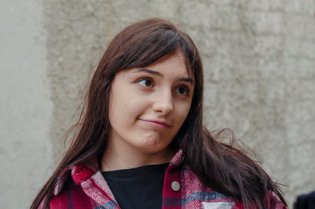 Portrait of a young woman with flirting facial expressions and wide open eyes. A beautiful woman...