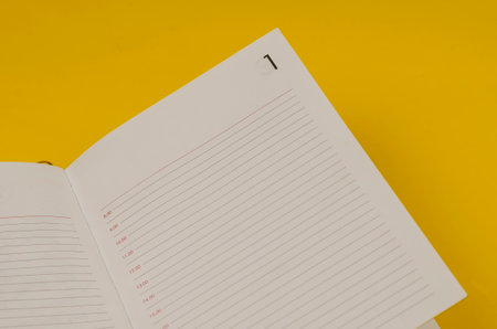 Business, routines, discipline, schedule concept. Opened agenda with blank pages and the number one on yellow.の写真素材