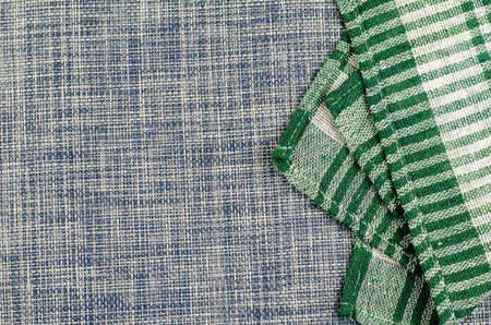 Green checkered blue denim cloth napkin. Copy space. Flat lay. No people.