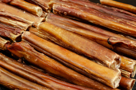 Bully sticks for dogs. Close-up of dried chew pet treats. Dehydrated bovine penis. Beef pizzle....