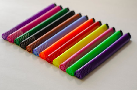 Colorful multi-colored felt-tip pens on a white background. Stationery. Children's creativity....