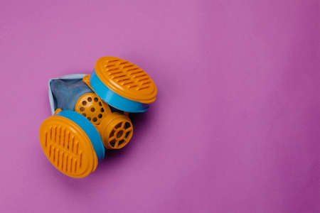 Occupational safety, special clothing, respiratory protection concept. Special means of personal respiratory protection against aerosols (dust, smoke, fog) or harmful gases. Selective focus.の写真素材