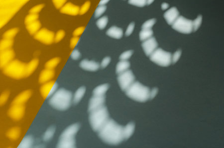 Minimalist light and shadow composition on yellow and blue. Abstract sunspots on a two-color...
