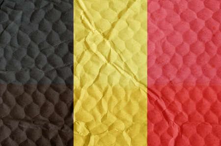 Black-yellow-red National Flag of Belgium on an uneven textured surface. The concept of freedom, independence of the nation.の写真素材