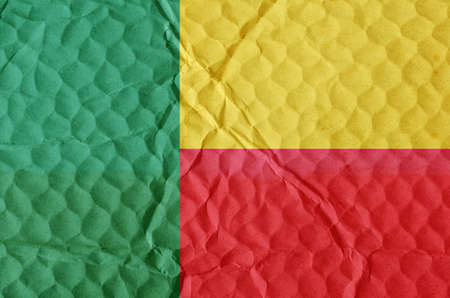 Green-yellow-red National Flag of Benin on an uneven textured surface. The concept of freedom, independence of the nation.の写真素材