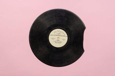 Old damaged Vinyl record with the popular Soviet song Ryzhik, sings Tamara Miansarova. Record by...