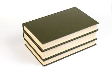 Three Green hardcover books on a white background. Stack of closed books. Side view. Selective focus.の写真素材