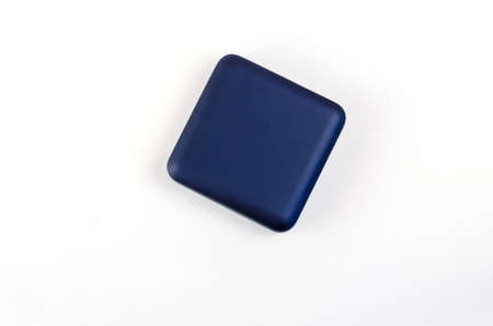 Small Square plastic gift box on white background. Closed blue box for rings, earrings, cufflinks and other jewelry.の写真素材