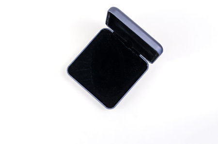 Open Small Square plastic gift box on white background. Blue box for packing engagement rings,...