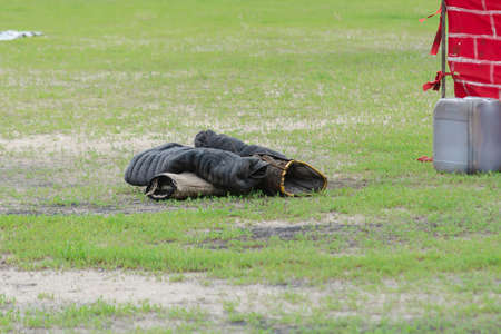 K9 dog training sleeves lie on the green grass. Special jute bite sleeve. Arm sleeve for Canine Dog Trainingの写真素材