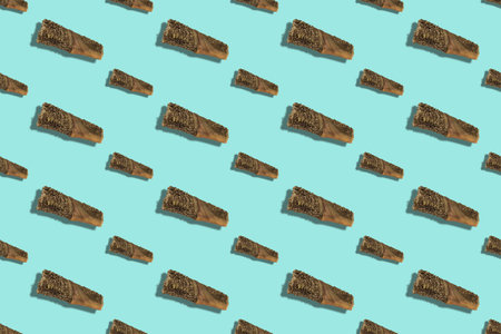 Repeatable pet treats on a pastel blue background. Sticks of dried beef tripe. Beef stomach. Dehydrated dog treats. Pet store, background, design.の写真素材