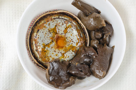 Botulism, the danger of food poisoning by canned food concept. Unsuitable marinated mushrooms in a...