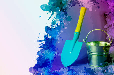 Blue garden shovel and bucket on colored background. Garden tool. New galvanized empty bucket. Digital watercolor painting.の写真素材