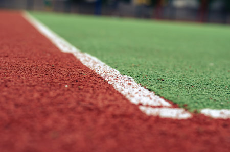 Close-up of an empty soccer field with artificial turf. The field for sports games with a coating of...